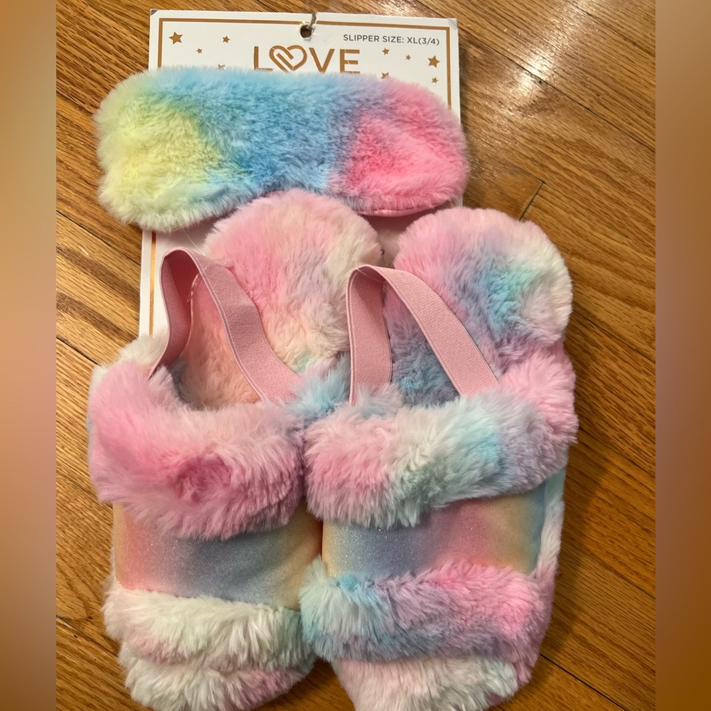 - Soft fuzzy rainbow slippers and eye mask